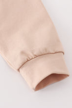 Load image into Gallery viewer, Beige turkey french knot ruffle top
