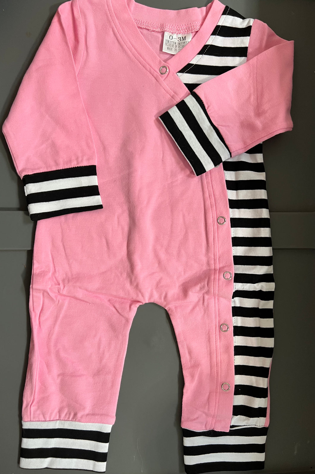 PINK WITH BLACK AND WHITE STRIPES ONESIE